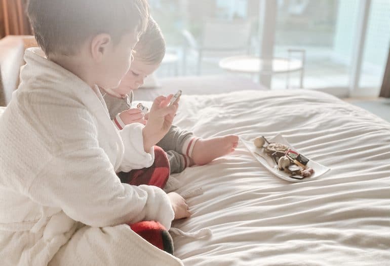 kids having a snack in bed Inn at Laurel Point